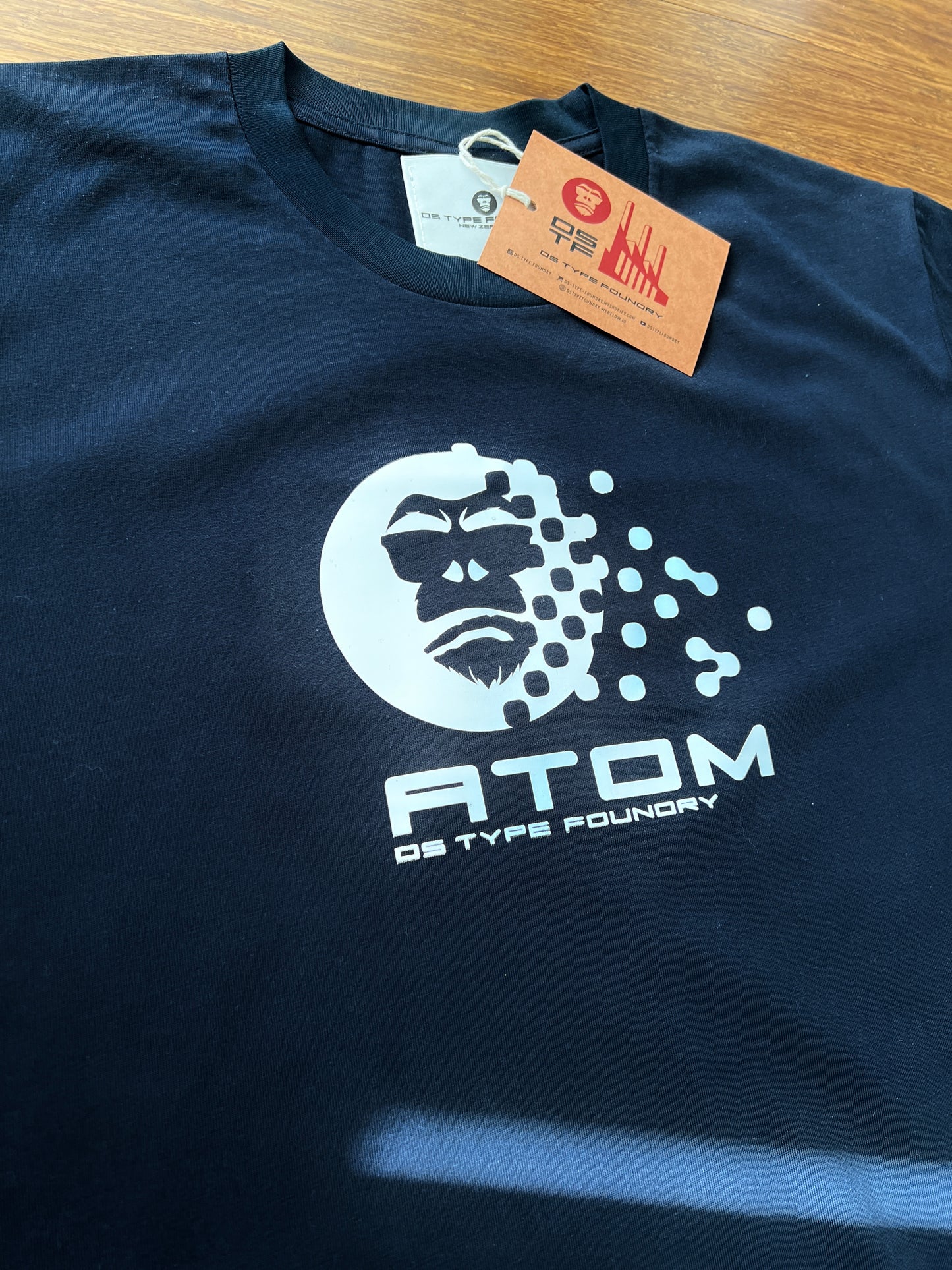 Atom t-shirt in White on Navy Blue. 100% heavy weight cotton Tee Typeface: Atom