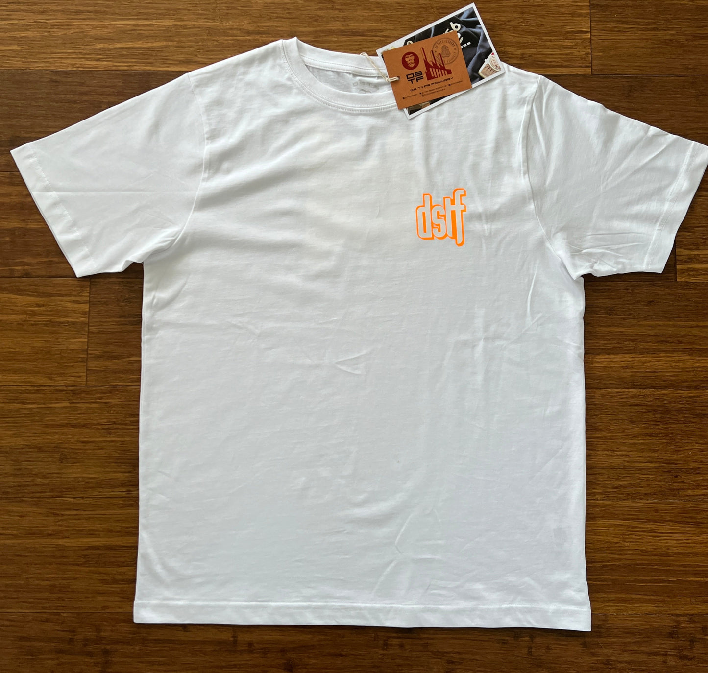 DSTF logo in Fluorescent Orange and white on quality cotton white tee