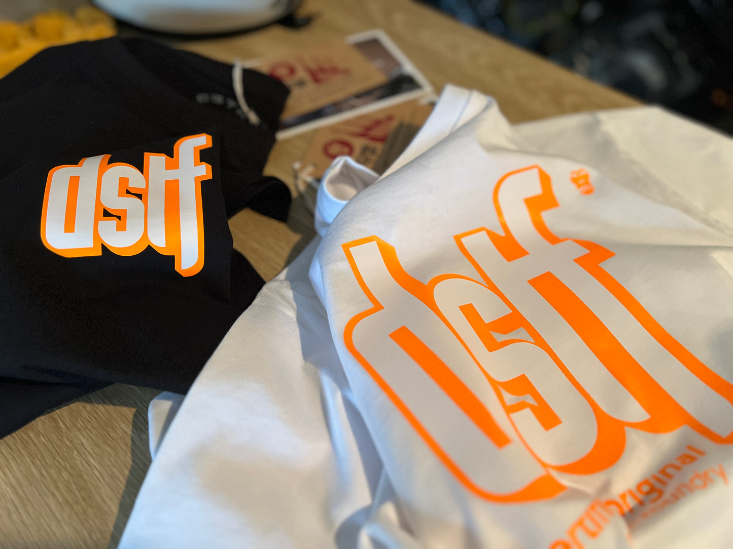 DSTF logo in Fluorescent Orange and white on quality cotton white tee