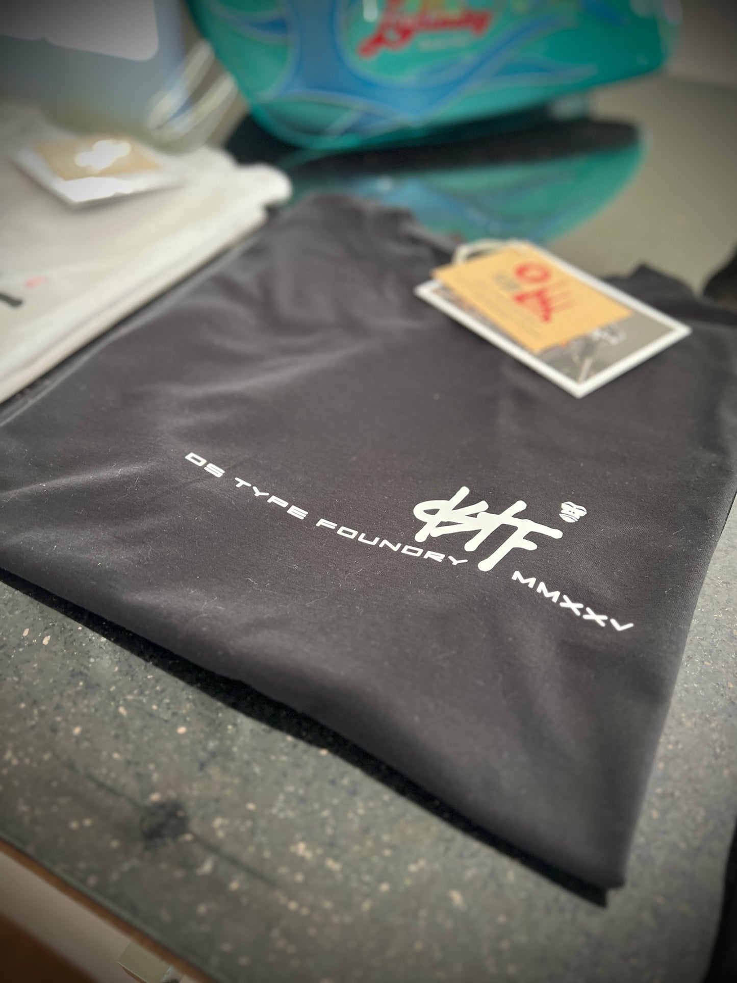 100348 DSTF script small logo design black tee