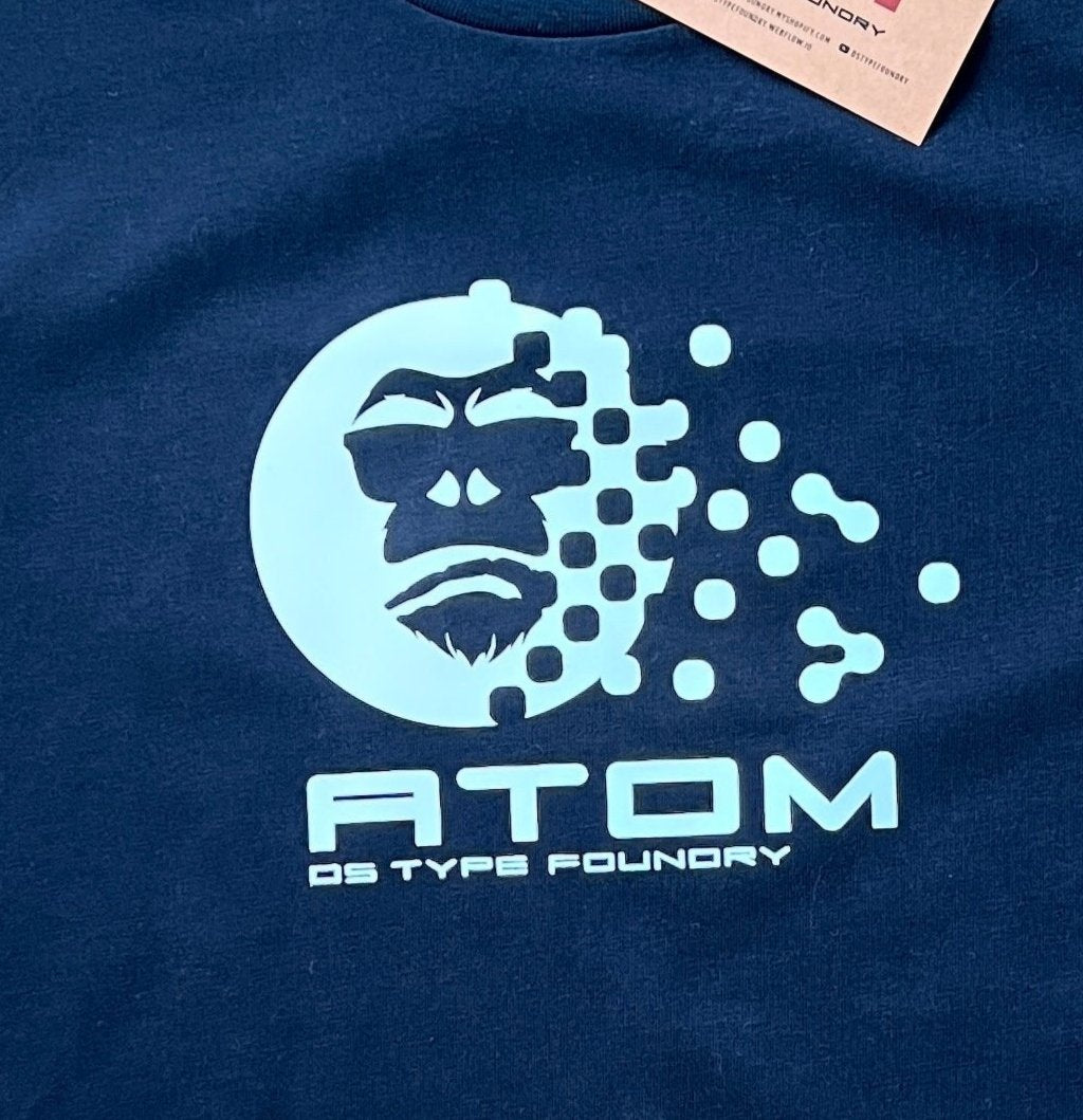 Atom t-shirt in White on Navy Blue. 100% heavy weight cotton Tee Typeface: Atom