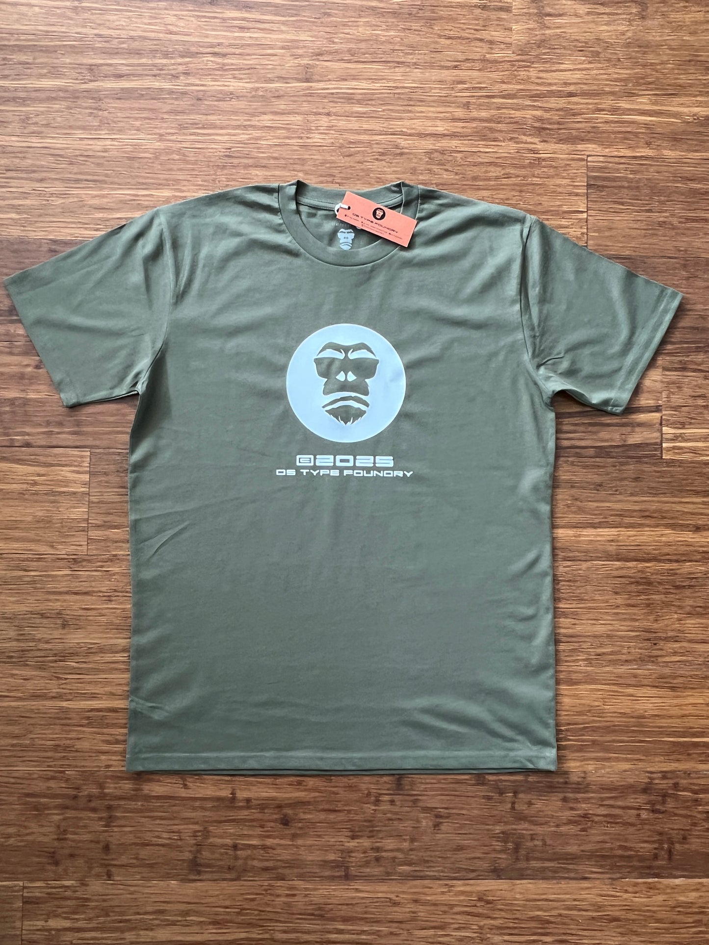 Gorilla 2025 in White on Army green 100% cotton.
