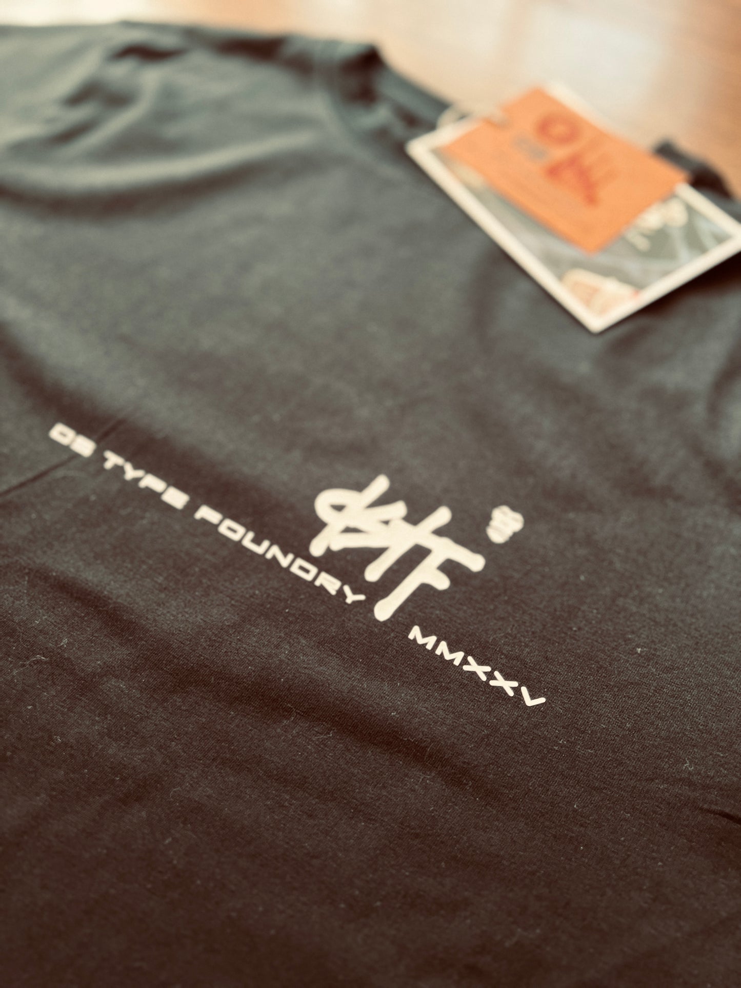 100348 DSTF script small logo design black tee