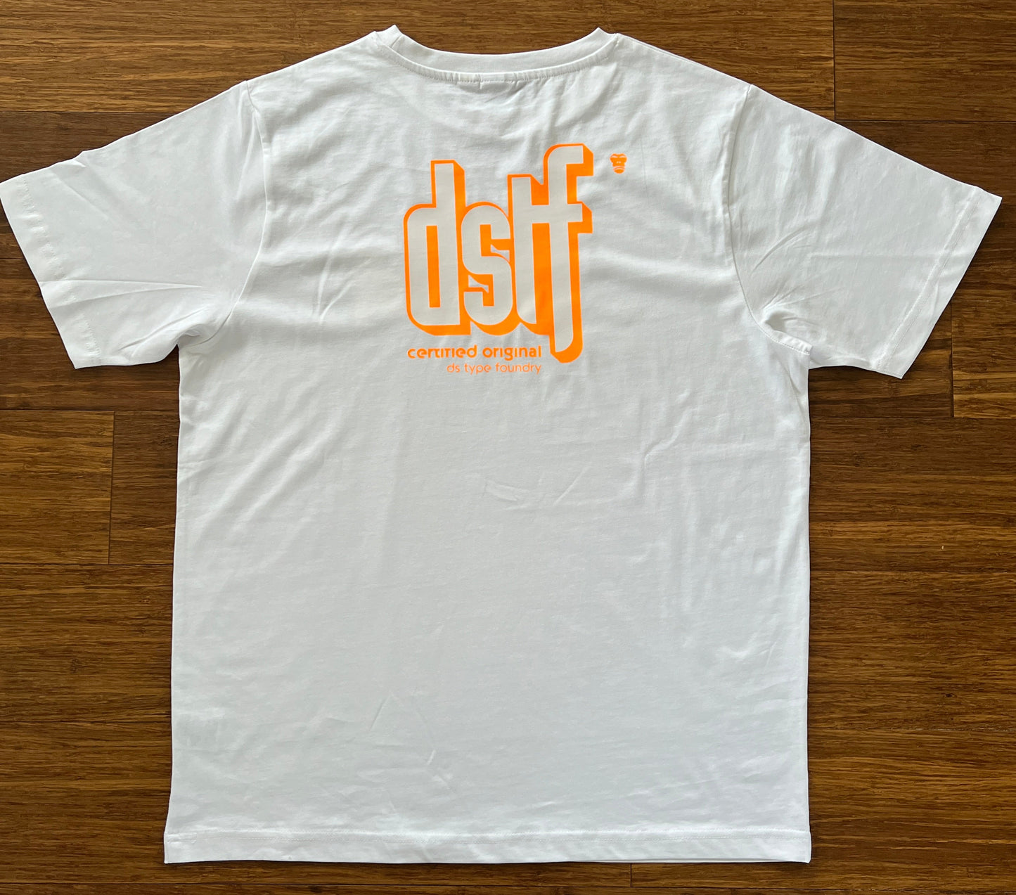DSTF logo in Fluorescent Orange and white on quality cotton white tee
