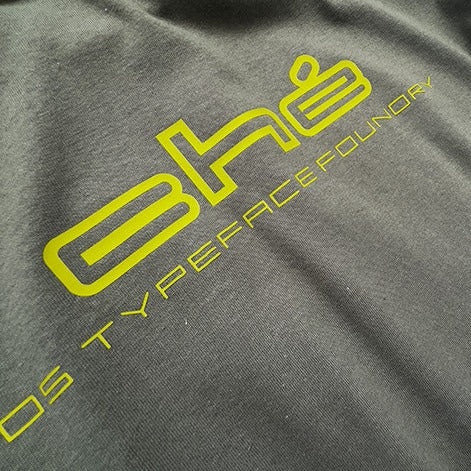 Che in Avocado Green on Army Green tee. Heavyweight 100% cotton 220gsm. Typeface: Che Balloon
