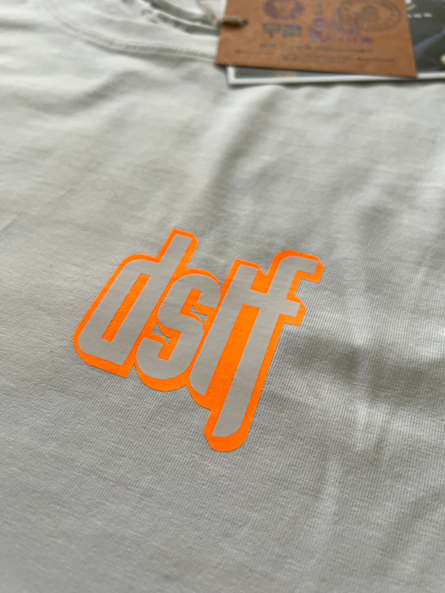 DSTF logo in Fluorescent Orange and white on quality cotton white tee