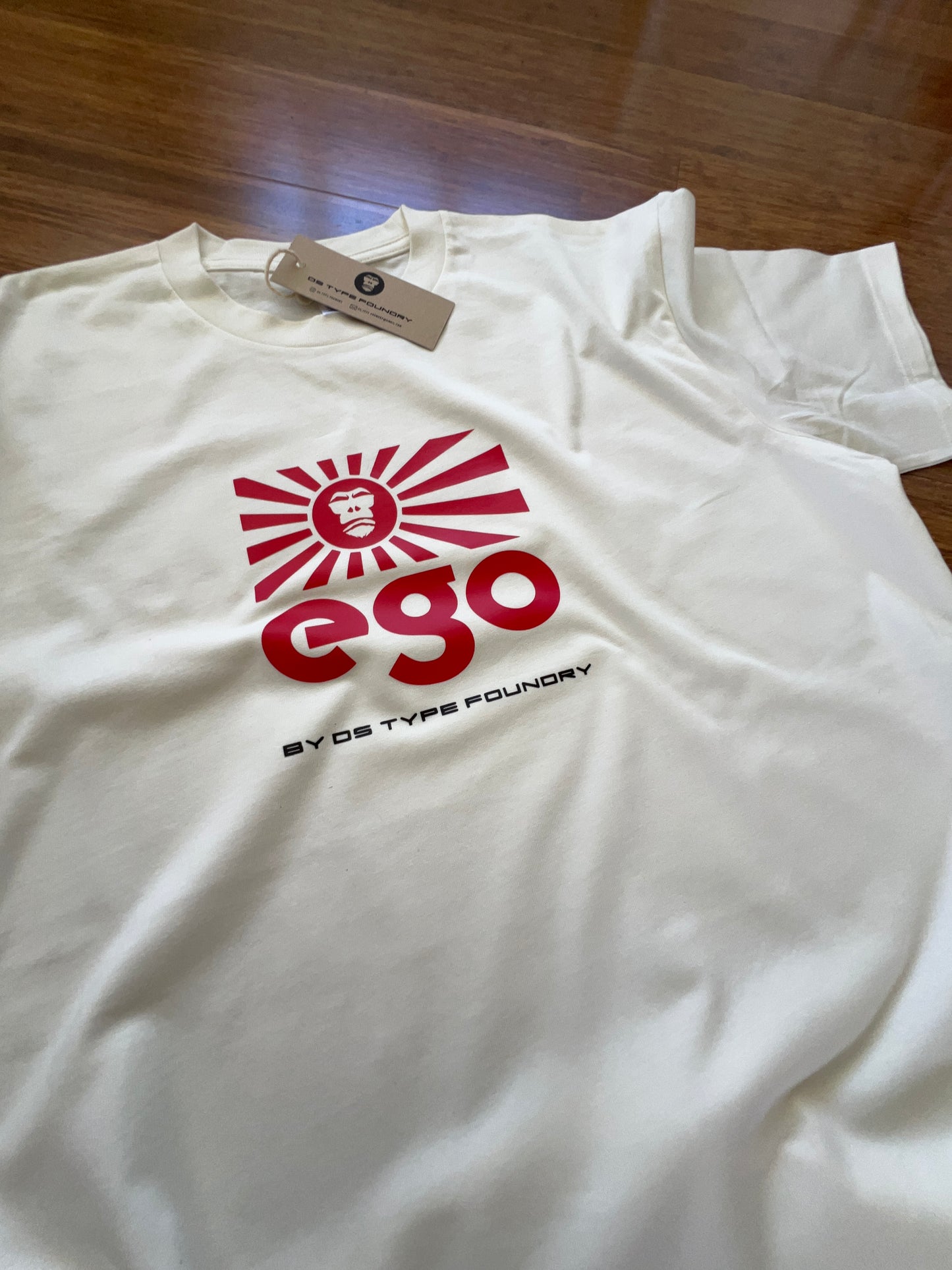 Ego in red on Natural White (cream) tee, 100% cotton 220gsm. Typeface: Ego