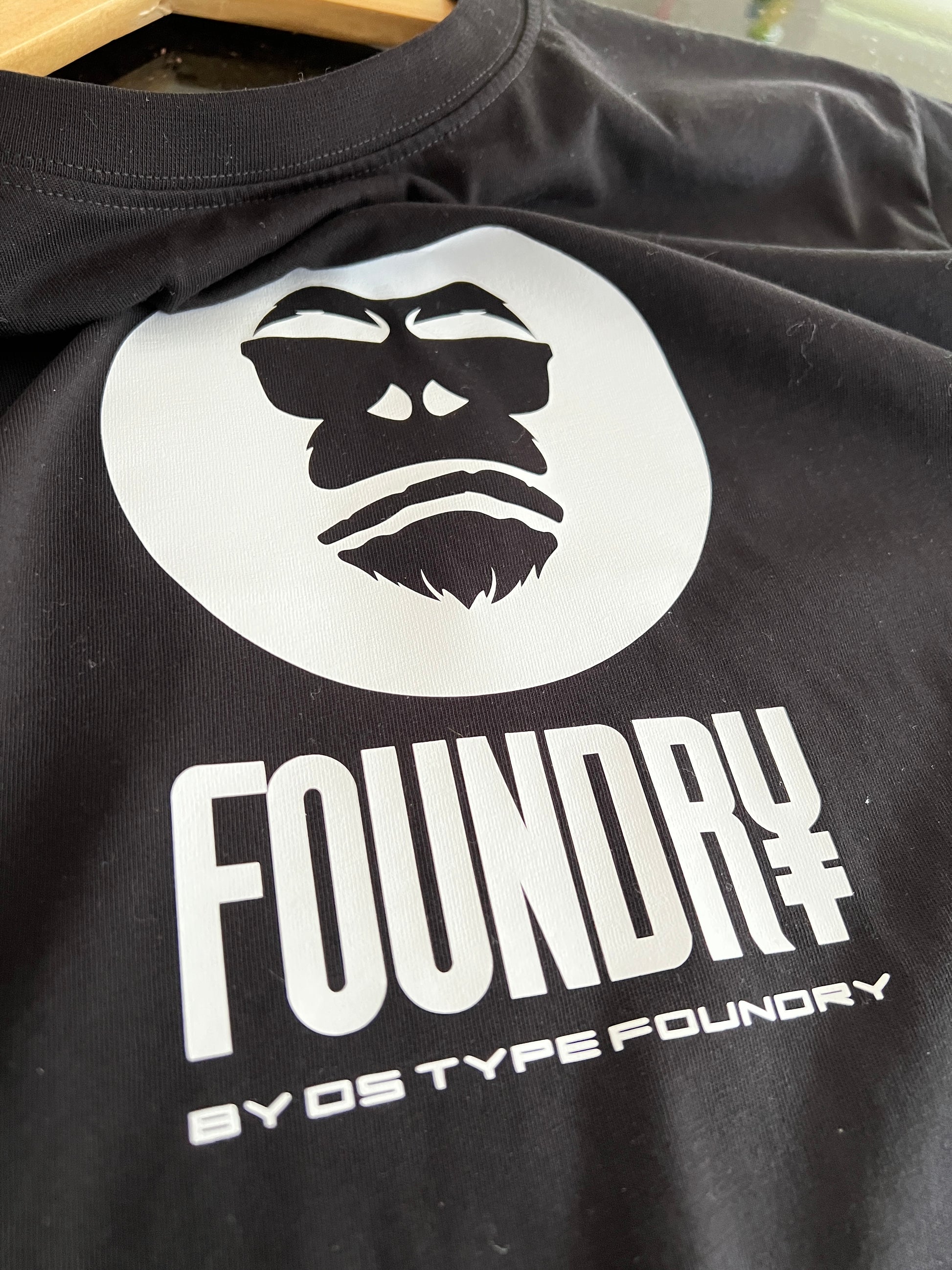 Foundry in White on Black, 100% cotton Tee.