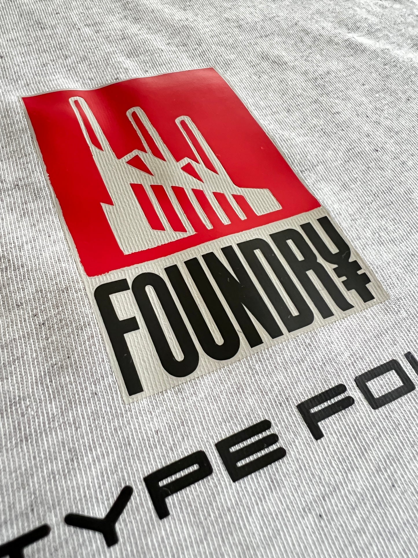 Foundry design in grey. 100% cotton Tee