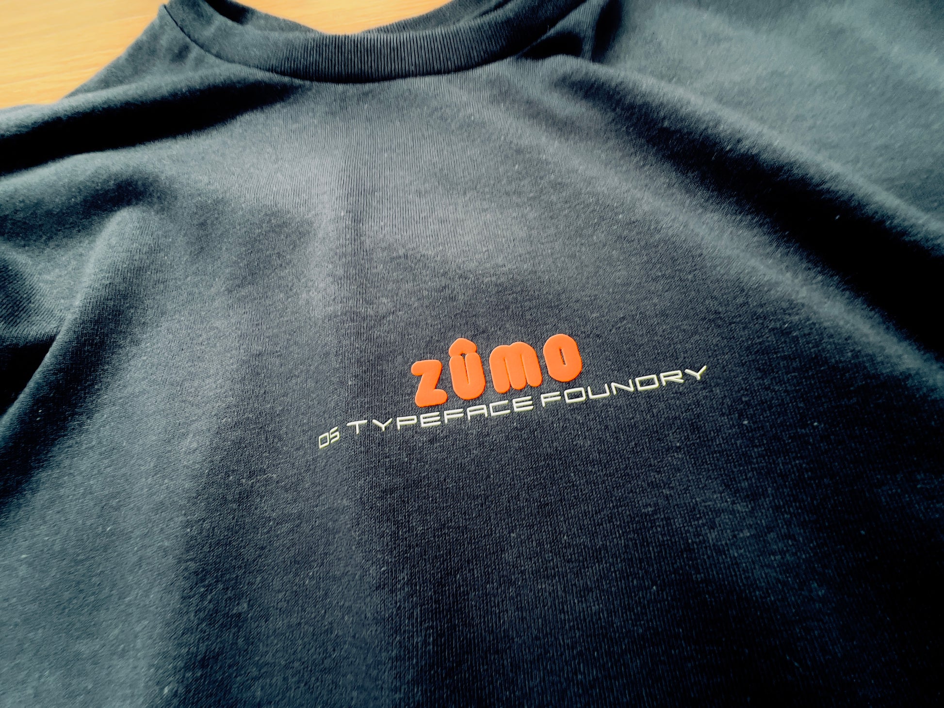 Zumo Puff Orange on Black tee. Heavyweight 100% cotton 220gsm. Typeface: Zumo