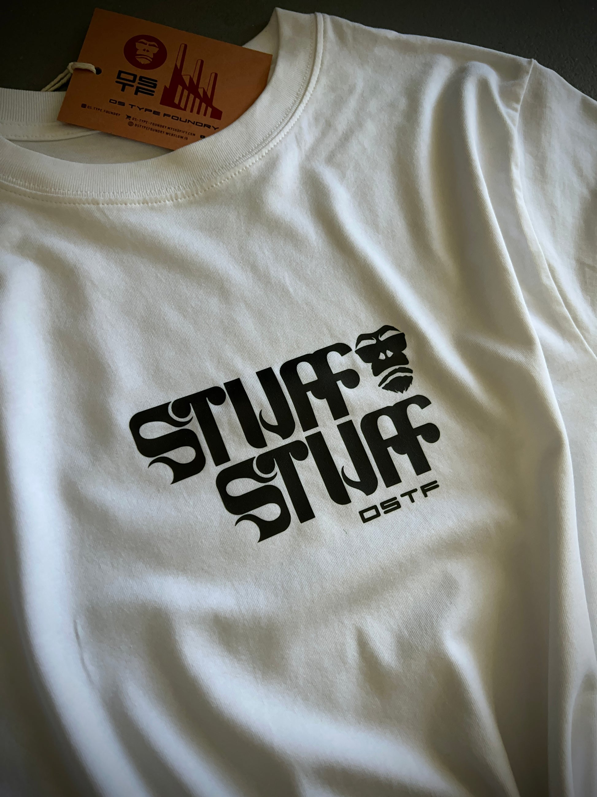 Stuff Stuff in black on white 100% cotton Tee. Can be available in medium weight 185gsm (6.5oz) and heavy weight 220gsm (7.7oz). Typeface: Stuff