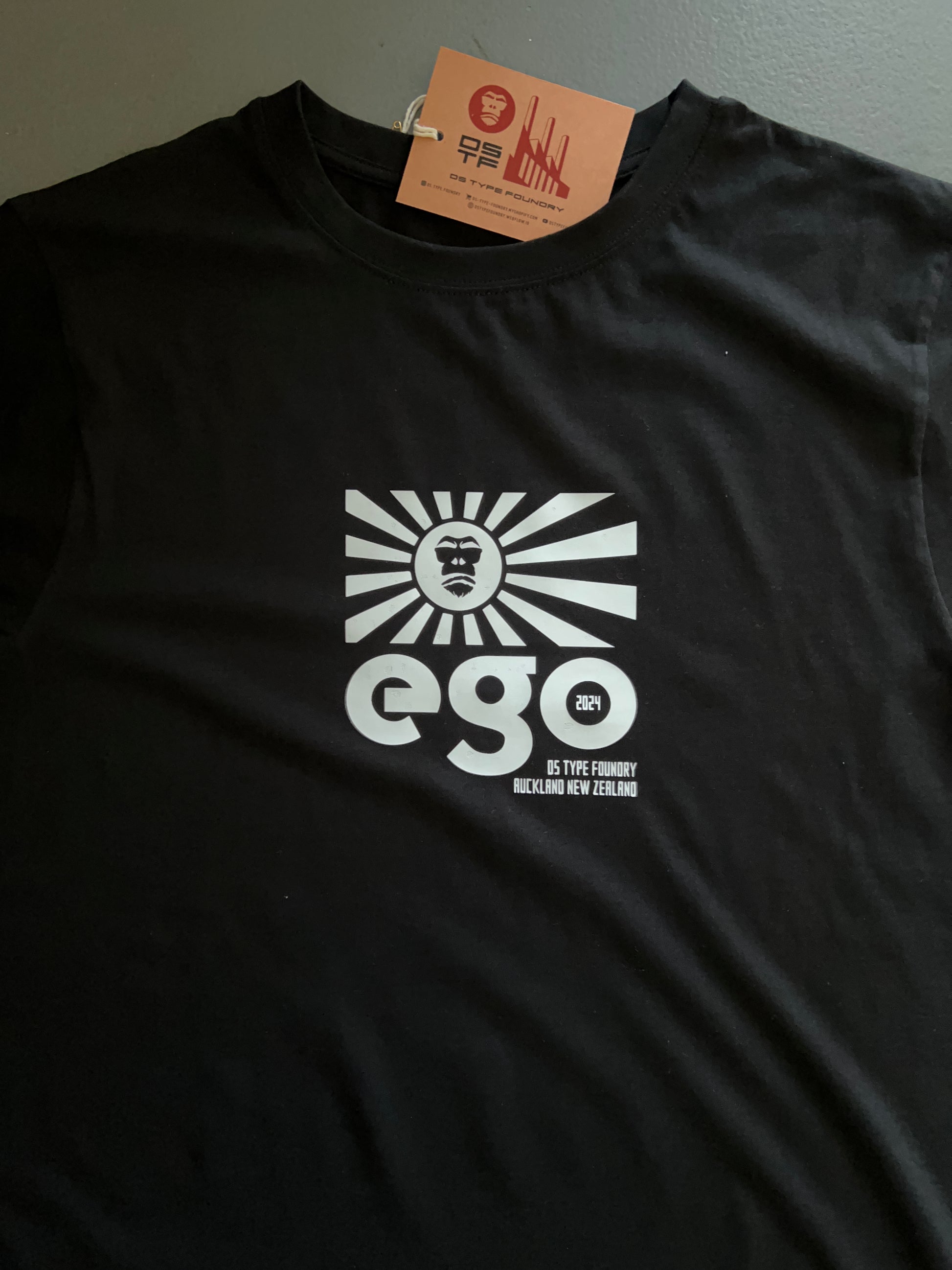 Ego in White on Black 100% cotton. Typeface: Ego