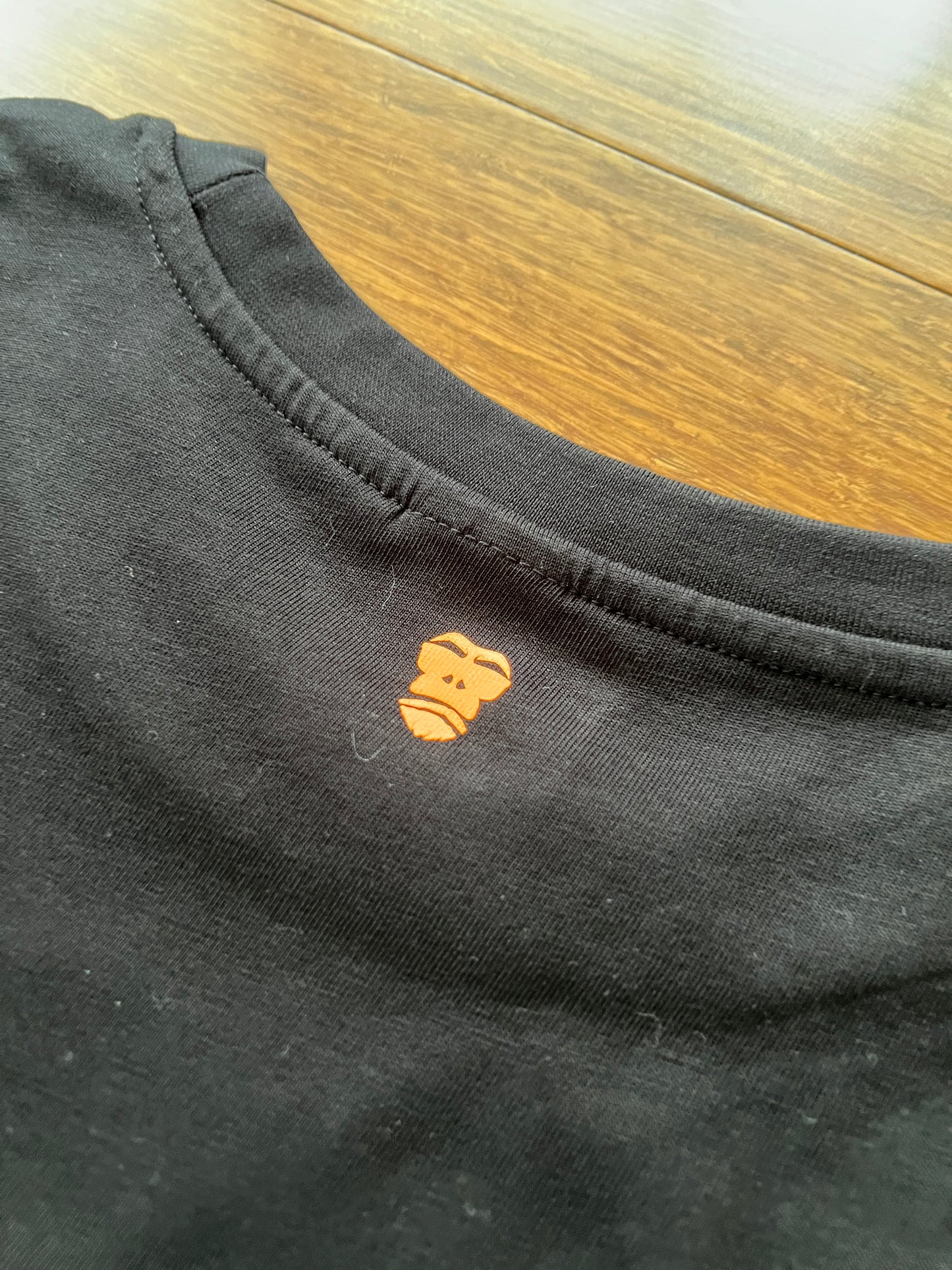 100345 DSTF logo 3D in Fluorescent Orange on black tee