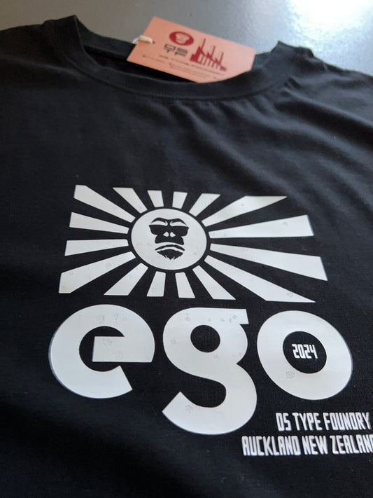 Ego in White on Black 100% cotton. Typeface: Ego