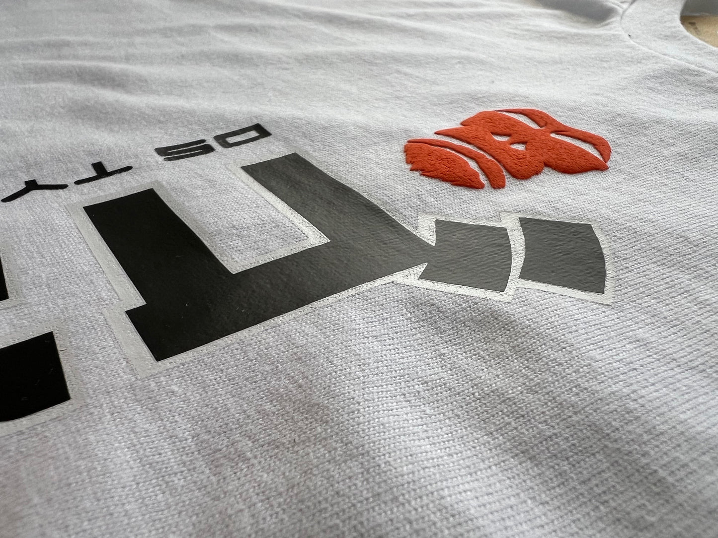 10030 Foundry. Heavy weight  t-shirt. Goriila in Japanese text. Special edition tee in black and white text with orange puff gorilla logo.