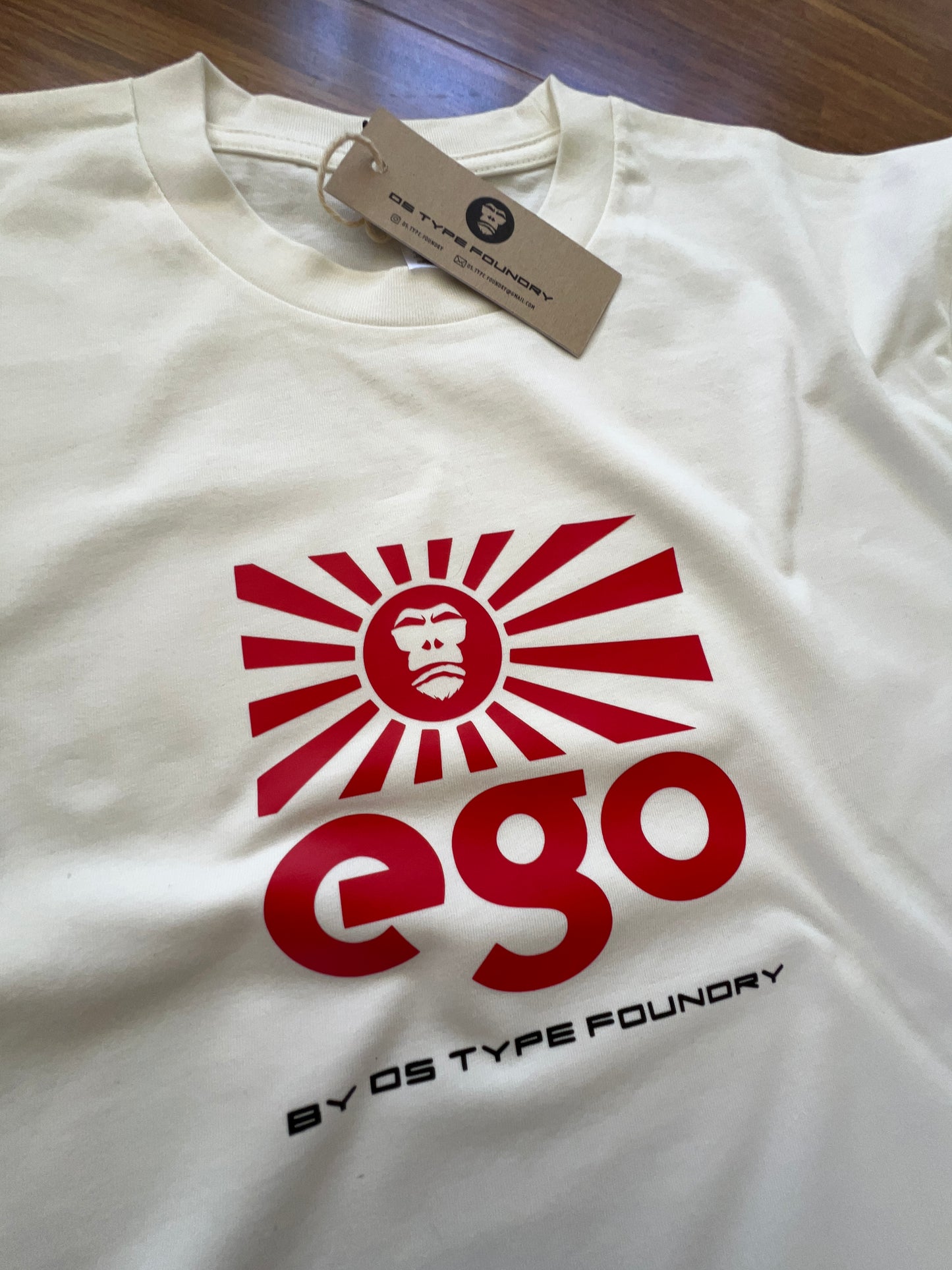 Ego in red on Natural White (cream) tee, 100% cotton 220gsm. Typeface: Ego