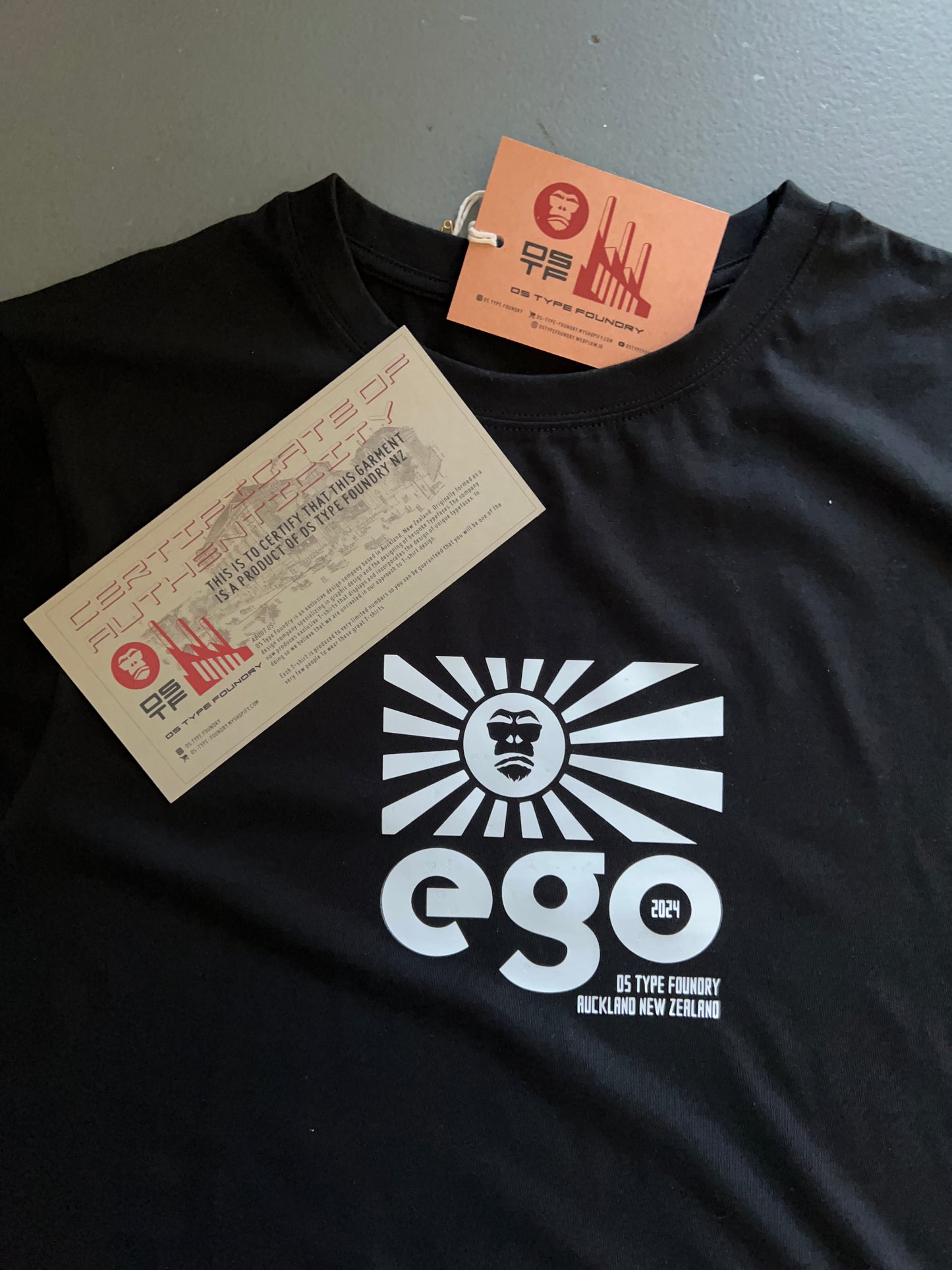 Ego in White on Black 100% cotton. Typeface: Ego