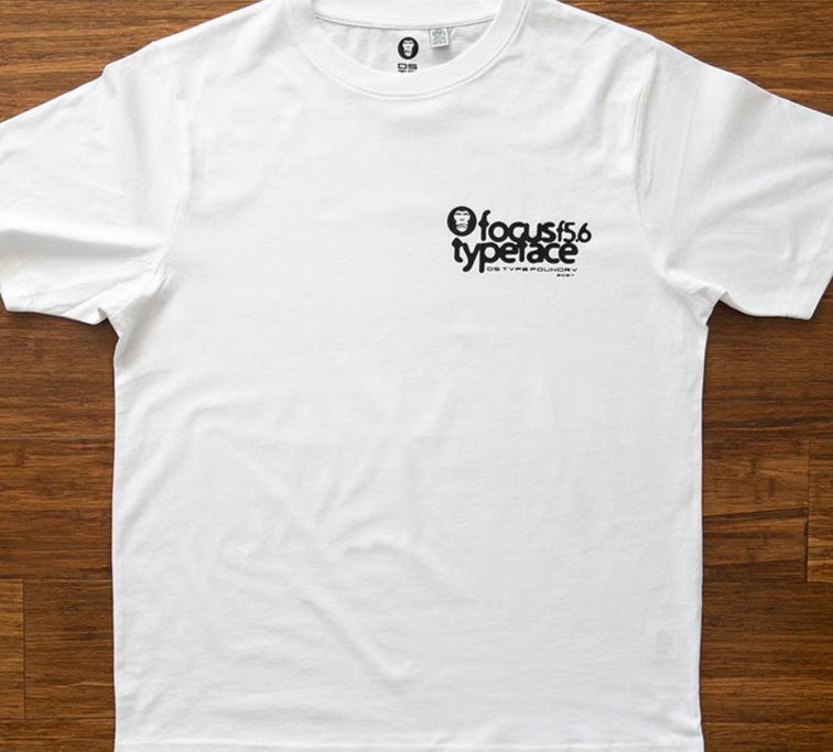 Focus typeface T-shirt design in white. Looks very cool. Available in medium weight 185gsm (6.5oz) and heavy weight 220gsm (7.7oz). Typeface: Focus f5.6