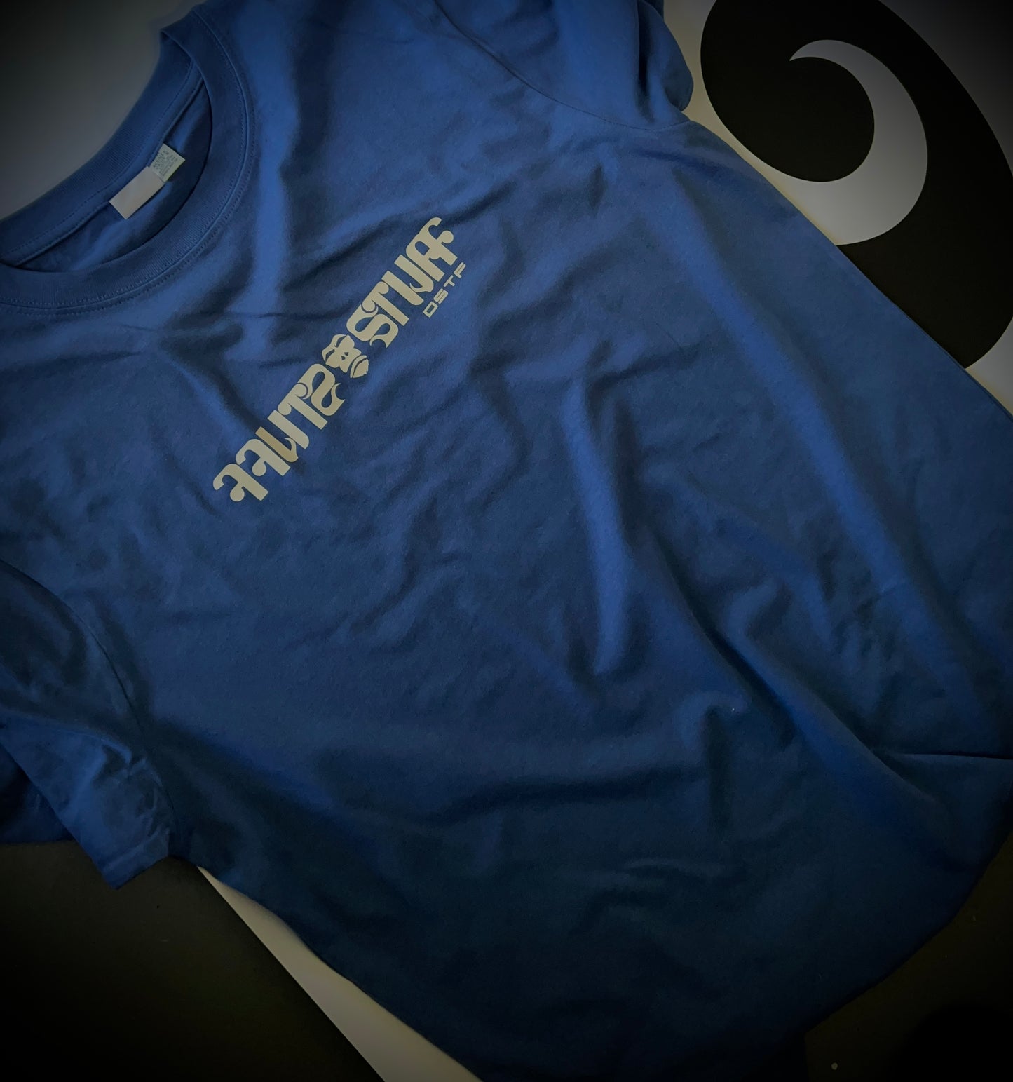 Gorilla Stuff in light grey on blue 100% cotton Tee. Can be available in medium weight 185gsm (6.5oz) and heavy weight 220gsm (7.7oz). Typeface: Stuff