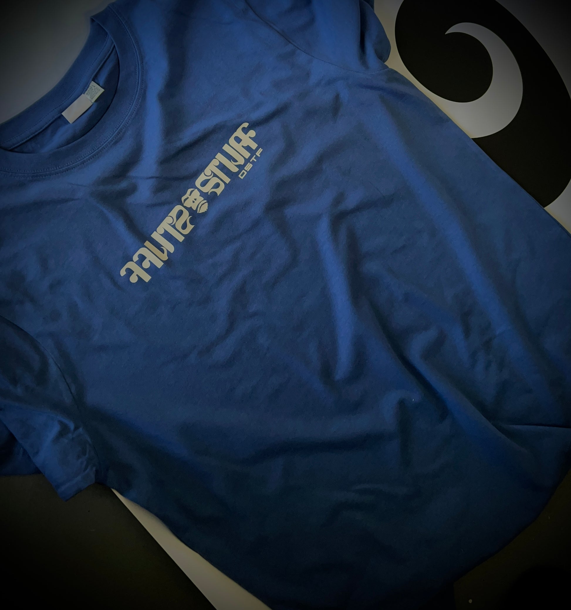 Gorilla Stuff in light grey on blue 100% cotton Tee. Can be available in medium weight 185gsm (6.5oz) and heavy weight 220gsm (7.7oz). Typeface: Stuff